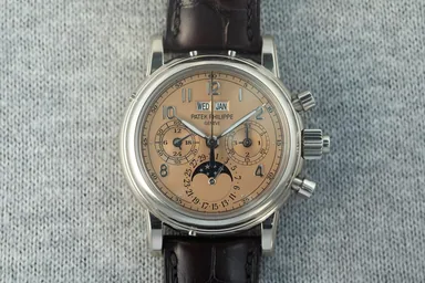 Patek Philippe 5004G — custom salmon dial and luminous hands — source photo